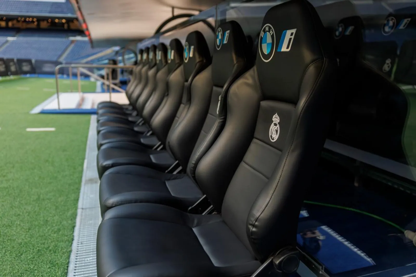 Real Madrid players' bench seats beside the Bernabéu pitch
