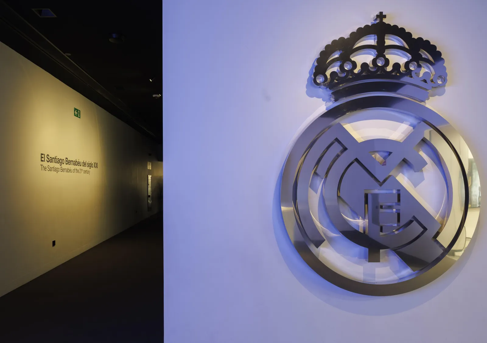 Silver Real Madrid crest on a wall inside the museum