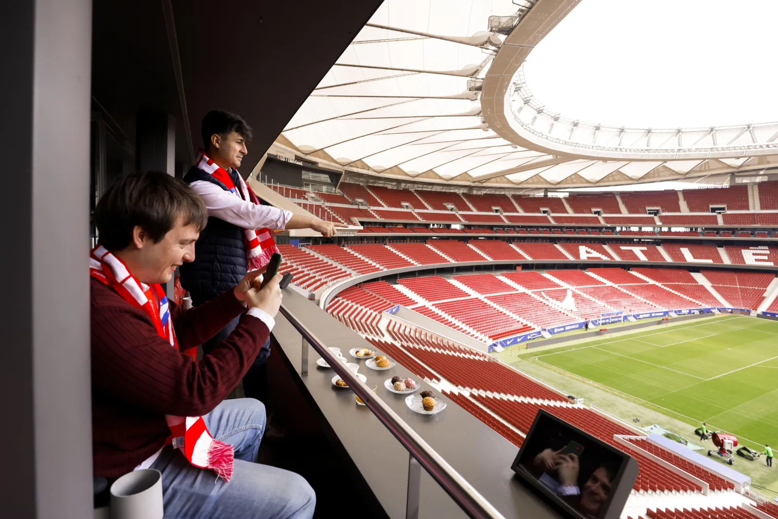 Guests eating breakfast in Simeone's box above the pitch