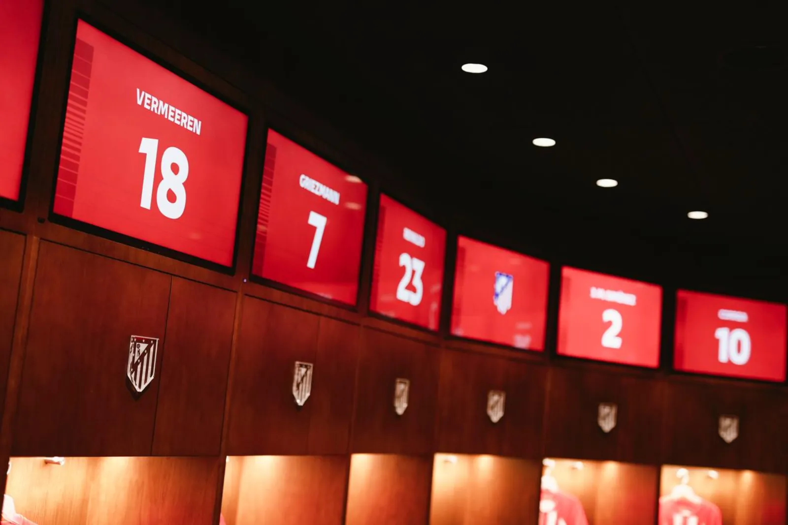 Player shirt numbers above the lockers in the Atlético first-team dressing room