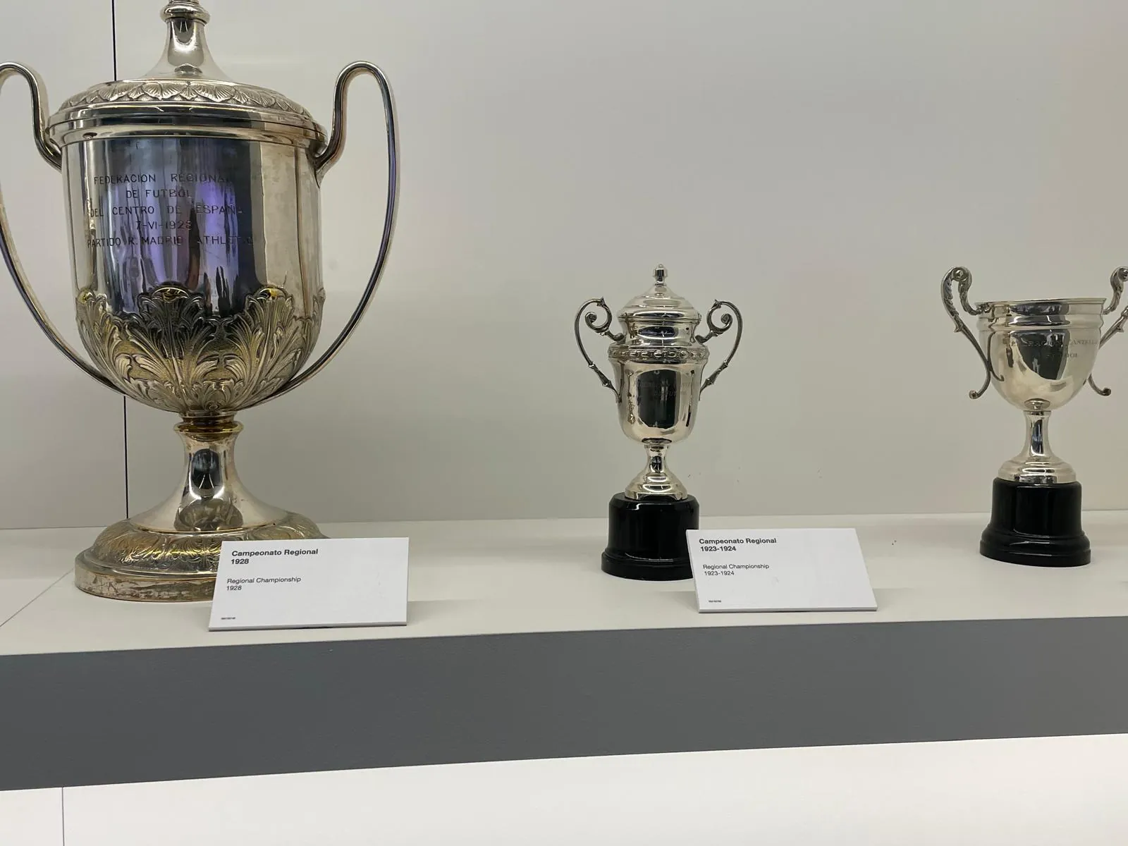 Early 20th-century Real Madrid trophies in a glass case